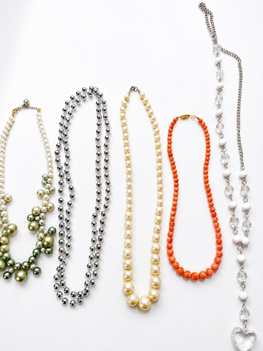 Five Elegant Necklaces Pearl And Silver Collection's On White